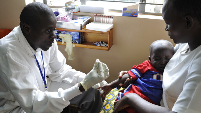 Doctor with patient severe malaria